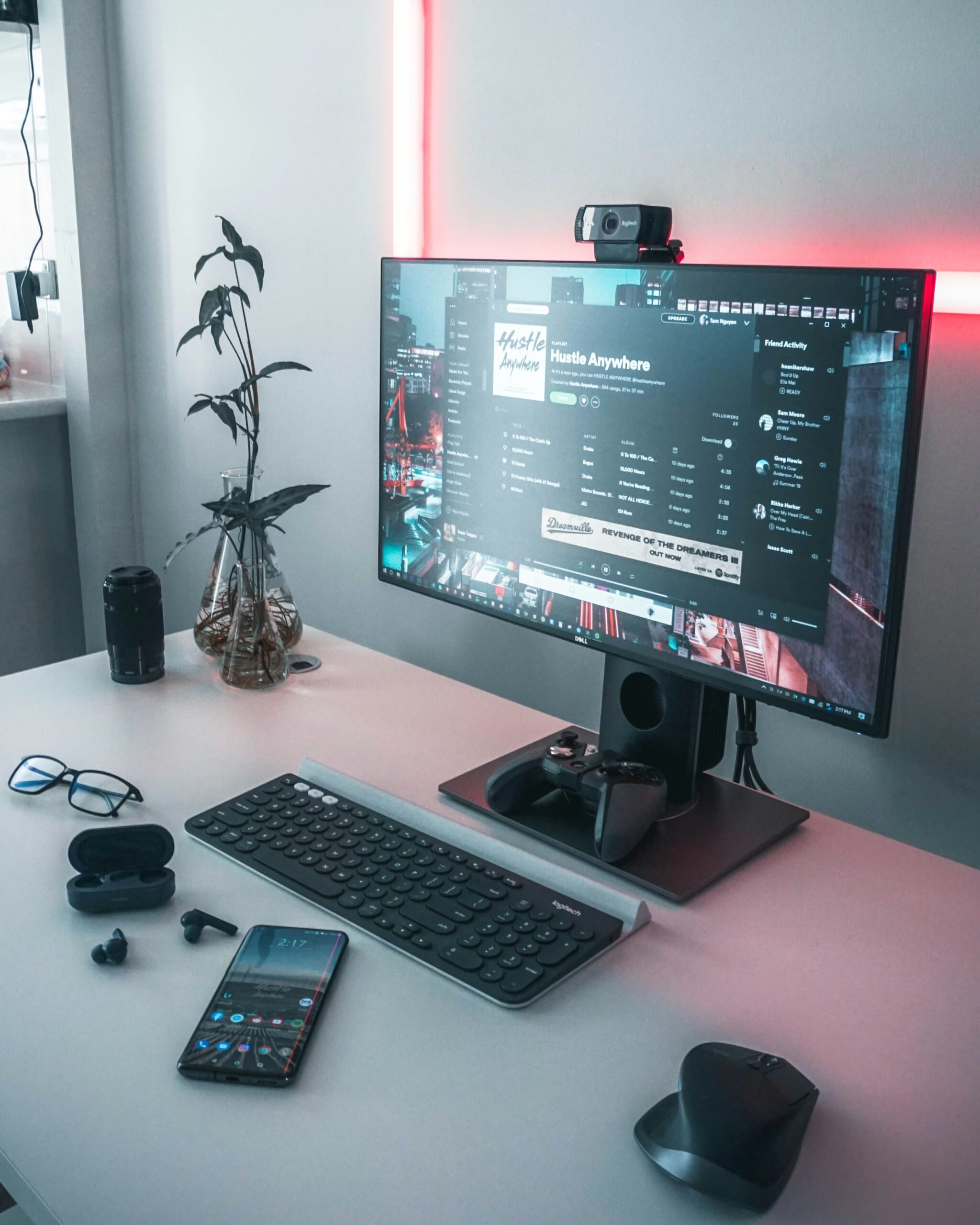 Modern desk setup with webcam mounted on a monitor — the SMB workspace for AI video creation